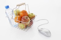 still life of computer mouse and fruit and water bottle in shopping basket royalty free: for comercial usage price on demand, no third party sales.