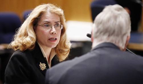 former phoenix va health care system worker dr. katherine mitchell, left, talks with vietnam veteran chuck byers, right, before the two testify about the current state of the va medical center in phoenix during a senate veterans' affairs committee field hearing monday, dec. 14, 2015, in gilbert, ariz. (ap photo/ross d. franklin)