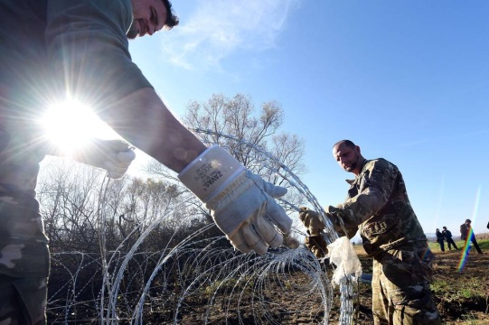 amid a wave of migration, slovenian soldiers set barbed-wire fences on the slovenian-croatian border, nov. 12.