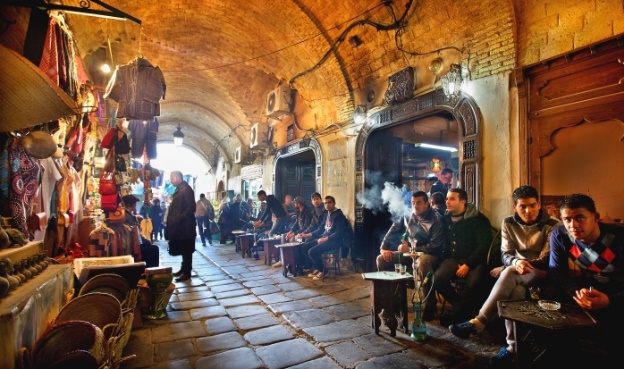 guests gather in the medina marketplace of tunis.